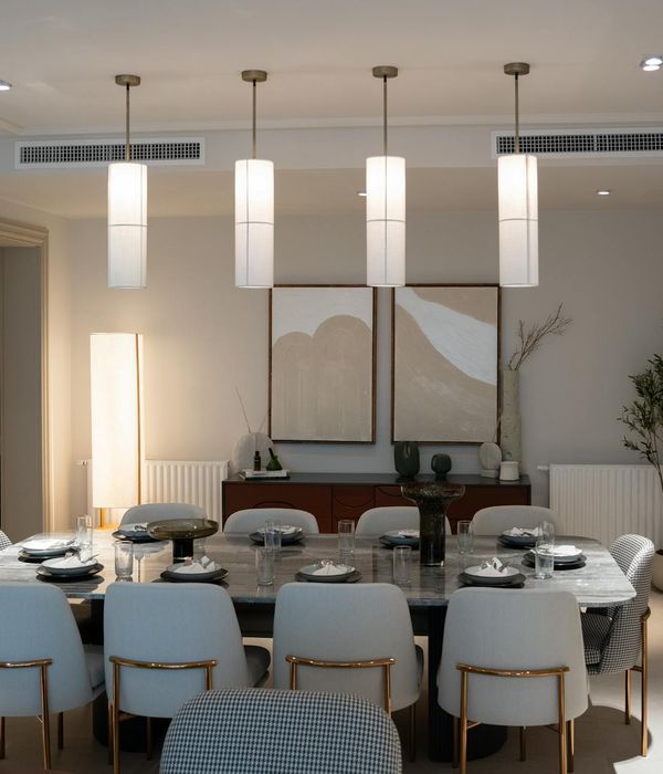 Modern, clean studio interior with atmospheric cyan lighting and ample space.